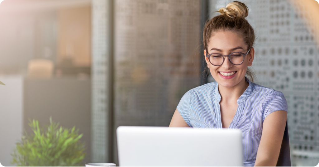 Woman leaving Facebook reviews on laptop